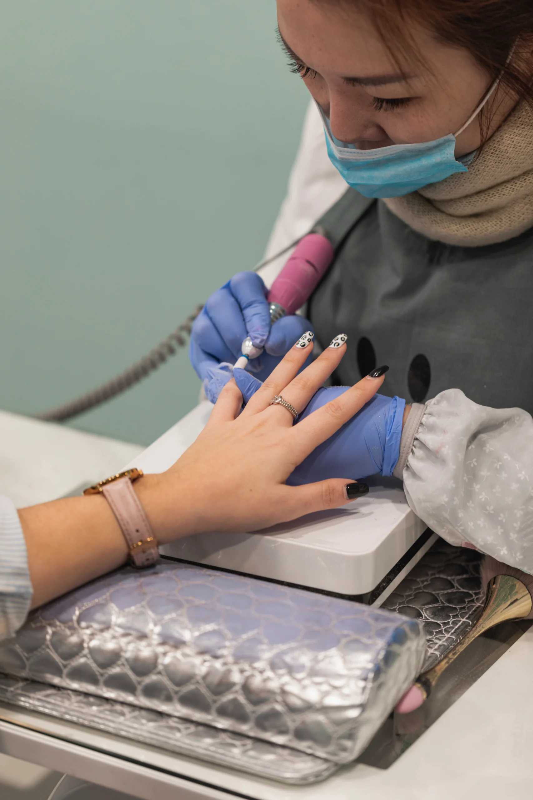 Professional manicure service session in a cozy salon.